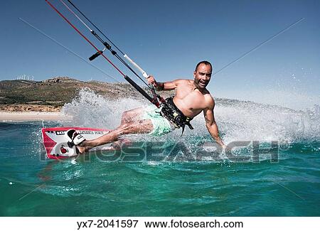 Stock Photo - Kitesurfing in Tarifa, Costa de la Luz, Cadiz, Andalusia, Spain.. Fotosearch