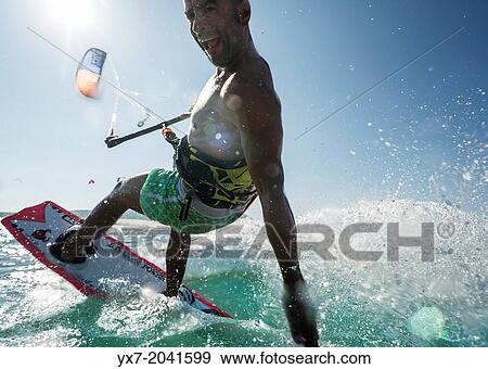 Stock Photo - Kitesurfing in Tarifa, Costa de la Luz, Cadiz, Andalusia, Spain.. Fotosearch