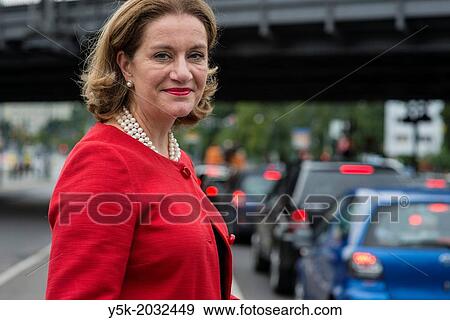 Klosterstrasse, East-Berlin, Berlin, Germany. Mrs. Monique van Daalen, the Dutch ambassador to Germany. Portrait near the embassy, waiting for local traffic before crossing the street. View Large Photo Image Stock Photo - Klosterstrasse, East-Berlin, Berlin, Germany. Mrs. Monique van Daalen, the Dutch ambassador to Germany. Portrait near the embassy, waiting for local traffic before crossing the street.. Fotosearch