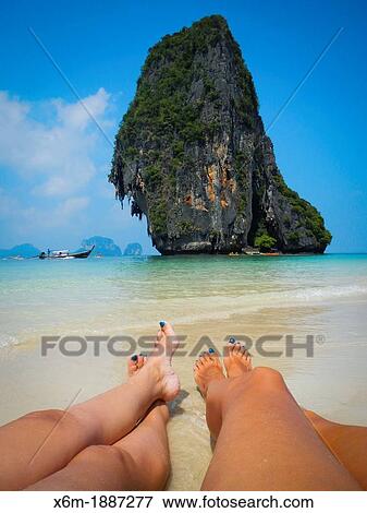 Koh Nok island and tourists in Pranang Cave Beach Railay Krabi province, Thailand View Large Photo Image Stock Photo - Koh Nok island and tourists in Pranang Cave Beach Railay Krabi province, Thailand. Fotosearch