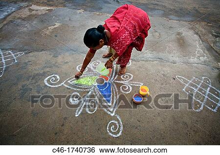 Stock Photograph - ? Kolam? refers to decorative artwork drawn on the floor in front of houses and in front of temples It is a time old cultural tradition of south Indian families, Mahabalipuram Mamallapuram, Tamil Nadu, India.. Fotosearch
