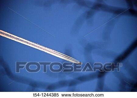 Kondenz strip of commercial aircraft View Large Photo Image Stock Photography - Kondenz strip of commercial aircraft. Fotosearch