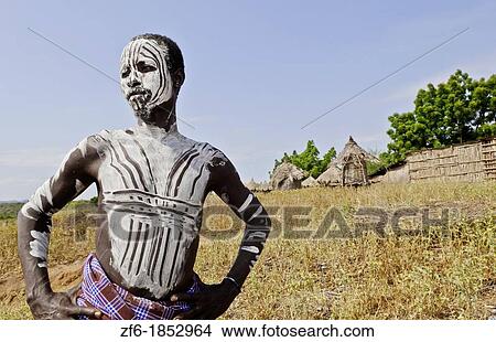 Picture - Korcho Ethiopia Africa village Lower Omo Valley Karo tribe young warrior with white painted face 25. Fotosearch