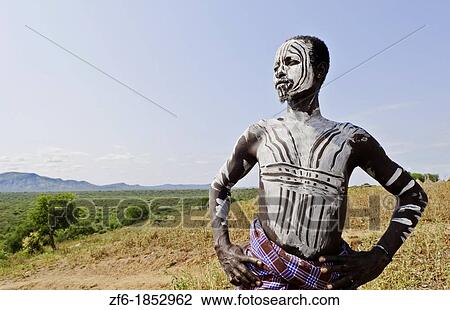 Korcho Ethiopia Africa village Lower Omo Valley Karo tribe young warrior with white painted face 25 View Large Photo Image Stock Image - Korcho Ethiopia Africa village Lower Omo Valley Karo tribe young warrior with white painted face 25. Fotosearch