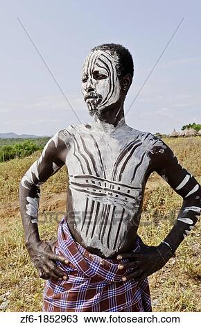 Korcho Ethiopia Africa village Lower Omo Valley Karo tribe young warrior with white painted face 25 View Large Photo Image Stock Image - Korcho Ethiopia Africa village Lower Omo Valley Karo tribe young warrior with white painted face 25. Fotosearch