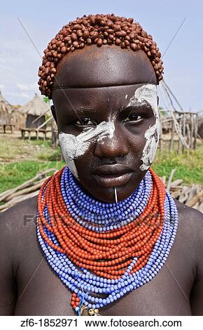 Korcho Ethiopia Africa village Lower Omo Valley Karo tribe with painted faces and red tight curls in hair 25 View Large Photo Image Stock Image - Korcho Ethiopia Africa village Lower Omo Valley Karo tribe with painted faces and red tight curls in hair 25. Fotosearch