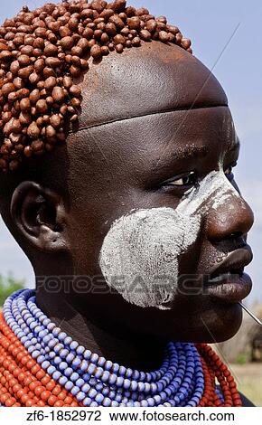 Korcho Ethiopia Africa village Lower Omo Valley Karo tribe with painted faces and red tight curls in hair 25 View Large Photo Image Stock Image - Korcho Ethiopia Africa village Lower Omo Valley Karo tribe with painted faces and red tight curls in hair 25. Fotosearch