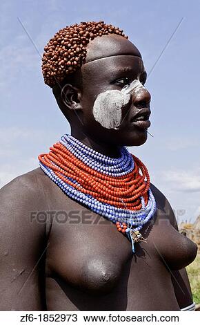 Korcho Ethiopia Africa village Lower Omo Valley Karo tribe with painted faces and red tight curls in hair 25 View Large Photo Image Stock Image - Korcho Ethiopia Africa village Lower Omo Valley Karo tribe with painted faces and red tight curls in hair 25. Fotosearch