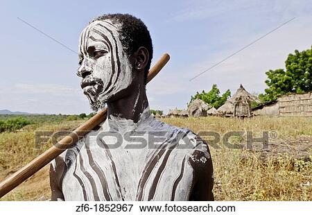 Korcho Ethiopia Africa village Lower Omo Valley Karo tribe young warrior with white painted face 25 View Large Photo Image Stock Photo - Korcho Ethiopia Africa village Lower Omo Valley Karo tribe young warrior with white painted face 25. Fotosearch