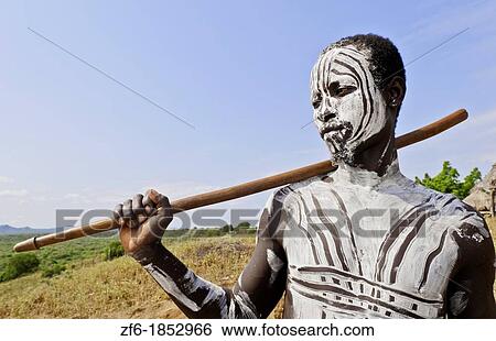 Korcho Ethiopia Africa village Lower Omo Valley Karo tribe young warrior with white painted face 25 View Large Photo Image Stock Photograph - Korcho Ethiopia Africa village Lower Omo Valley Karo tribe young warrior with white painted face 25. Fotosearch