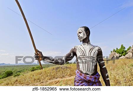 Korcho Ethiopia Africa village Lower Omo Valley Karo tribe young warrior with white painted face 25 View Large Photo Image Stock Photography - Korcho Ethiopia Africa village Lower Omo Valley Karo tribe young warrior with white painted face 25. Fotosearch