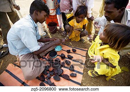 Korku Village Market. Child getting tattoos on her hand. Khalwa, Madhya Pradesh, India. View Large Photo Image Stock Image - Korku Village Market. Child getting tattoos on her hand. Khalwa, Madhya Pradesh, India.. Fotosearch