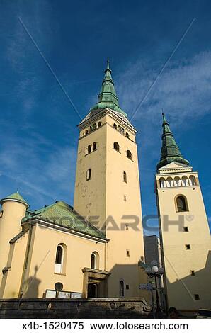 Kostol Najsvatejsej Trojice the Church of Holy Trinity and Burian tower at the Namestie Andreja Hlinku square Ailina Slovakia Europe View Large Photo Image Stock Photography - Kostol Najsvatejsej Trojice the Church of Holy Trinity and Burian tower at the Namestie Andreja Hlinku square Ailina Slovakia Europe. Fotosearch