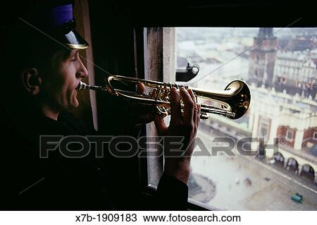 Krakow Poland A lone bugler sounds his horn every hour from the tower of St Mary's church View Large Photo Image Stock Image - Krakow Poland A lone bugler sounds his horn every hour from the tower of St Mary's church. Fotosearch