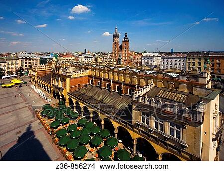 Picture - Krakow Poland Cloth Hall Sukiennice and St Mary's Mariacki Church at Main Market Square Rynek Glowny Old Town. Fotosearch