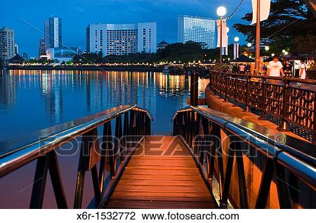 Stock Image - Kuching riverfront at dusk. Fotosearch