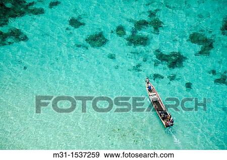 Kuna native fishermen in boat San Blas archipelago, Caribbean, Panama, Central America View Large Photo Image Stock Photo - Kuna native fishermen in boat San Blas archipelago, Caribbean, Panama, Central America. Fotosearch