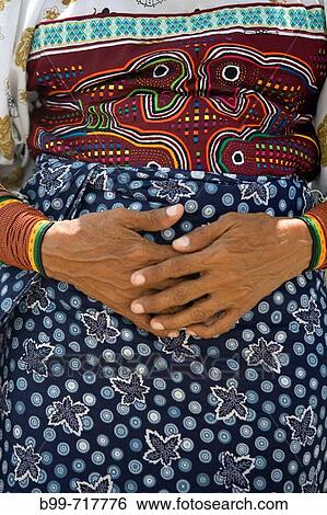 Stock Photograph - KUNA NATIVE INDIAN WOMAN HANDS MOLA PATTERN CLOTHES PANAMA CITY REPUBLIC OF PANAMA. Fotosearch