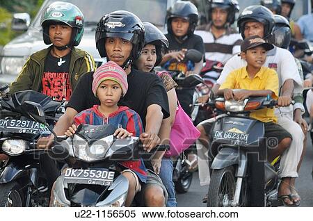 Stock Photography - Kuta (Bali, Indonesia): scooters traffic towards the beach. Fotosearch