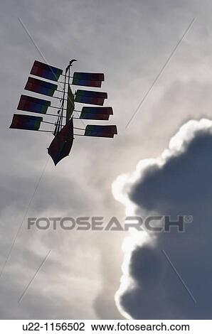 Stock Image - Kuta Beach (Bali, Indonesia): a kite in the sky. Fotosearch