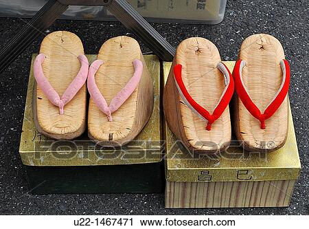 Kyoto (Japan): geta (traditional Japanese footwear that resemble both clogs and flip-flops) sold at the Tenjin flea market, by the Kitano Tenmangu shrine View Large Photo Image Stock Image - Kyoto (Japan): geta (traditional Japanese footwear that resemble both clogs and flip-flops) sold at the Tenjin flea market, by the Kitano Tenmangu shrine. Fotosearch