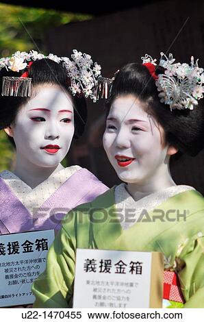 Kyoto (Japan): maiko (apprentice geishas) during the Sakura, along Shinbashi-dori in Gion, collecting money for the 2011 tsunami victims View Large Photo Image Stock Photography - Kyoto (Japan): maiko (apprentice geishas) during the Sakura, along Shinbashi-dori in Gion, collecting money for the 2011 tsunami victims. Fotosearch