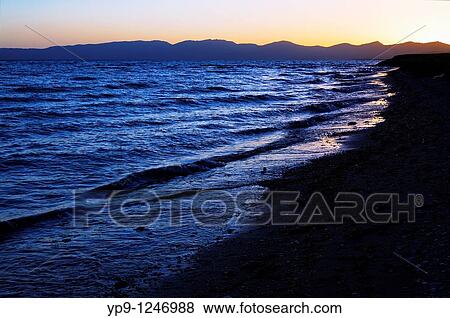 Kyrgyzstan - Lake Song Kul - sunset over the mountains surrounding Lake Song Kul View Large Photo Image Stock Photo - Kyrgyzstan - Lake Song Kul - sunset over the mountains surrounding Lake Song Kul. Fotosearch