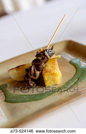 L? Albereta. Gualtiero Marchesi Restaurant.? Spiedino di Lumache con Polenta e Finocchio?. Erbusco, province of Brescia, in Lombardy. View Large Photo Image Stock Photograph - L? Albereta. Gualtiero Marchesi Restaurant.? Spiedino di Lumache con Polenta e Finocchio?. Erbusco, province of Brescia, in Lombardy.. Fotosearch
