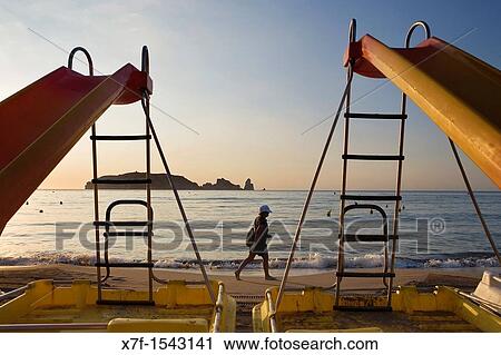 L? Estartit Pedal boats in Gran beach In background Medes Islands Costa Brava Girona province Catalonia Spain View Large Photo Image Stock Image - L? Estartit Pedal boats in Gran beach In background Medes Islands Costa Brava Girona province Catalonia Spain. Fotosearch