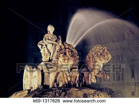 Stock Photograph - La Cibeles Fountain The fountain of Cibeles is found in the part of Madrid commonly called the Paseo de Recoletos This fountain, named after Cybele or Ceres, Roman goddess of nature, is seen as one of Madrid's most important symbols. Fotosearch