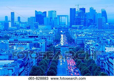 Stock Image - La Defense view from the Arc de Triomphe at dusk, Paris, France. Fotosearch