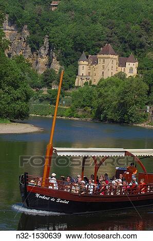 La Roque Gageac, Malartrie Castle, Perigord, River Dordogne, Dordogne River, Tourist boat, gabare boat, Tour boats, Dordogne valley, Perigord Noir, Aquitaine, France, Europe. View Large Photo Image Stock Photo - La Roque Gageac, Malartrie Castle, Perigord, River Dordogne, Dordogne River, Tourist boat, gabare boat, Tour boats, Dordogne valley, Perigord Noir, Aquitaine, France, Europe.. Fotosearch