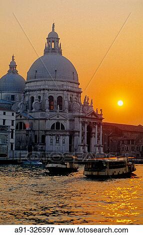Stock Photo - La Salute church. The Grand Canal at dusk. Venice. Italy.. Fotosearch