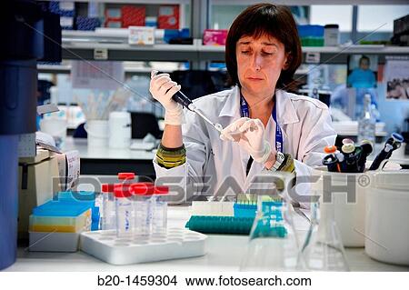 Picture - Laboratory technician using micropipette, Neuroscience lab, Research in neuromuscular disorders, neurodegenerative diseases, parkinson, dementia and multiple sclerosis, Biodonostia Health and Biomedicine Research Institute. Fotosearch