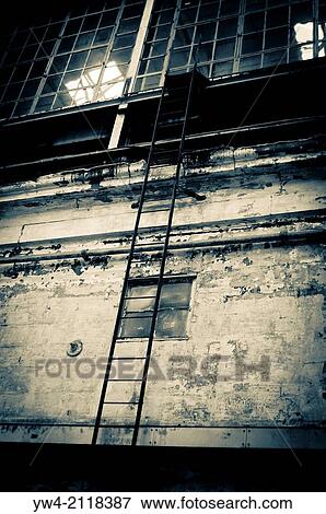 Stock Photo - Ladder in an Abandoned industrial building, Cockatoo Island, Sydney, Australia.. Fotosearch