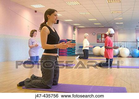 Ladies streching in pilates class View Large Photo Image Stock Photograph - Ladies streching in pilates class. Fotosearch