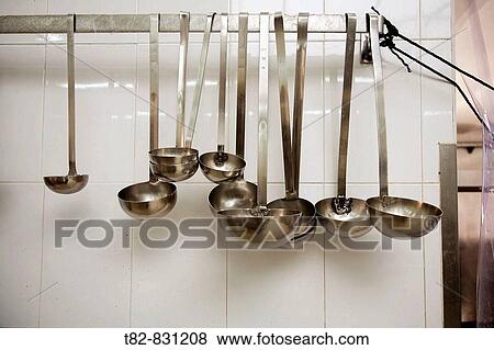 Ladles in a kitchen View Large Photo Image Stock Photo - Ladles in a kitchen. Fotosearch