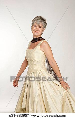 Lady in her early 60s in a studio setting View Large Photo Image Stock Photo - Lady in her early 60s in a studio setting. Fotosearch