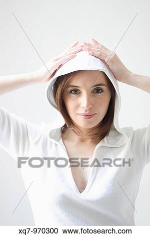 Stock Image - Lady in white hood. Fotosearch