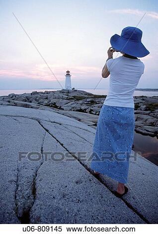 lady photographer at peggy's cove lighthouse nova scotia canada View Large Photo Image Stock Photography - lady photographer at peggy's cove lighthouse nova scotia canada. Fotosearch