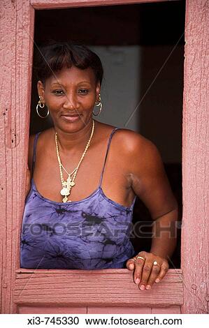 Lady standing in a doorway, Trinidad, Sancti Spiritus Province, Cuba View Large Photo Image Stock Image - Lady standing in a doorway, Trinidad, Sancti Spiritus Province, Cuba. Fotosearch