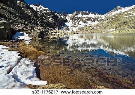 Laguna Grande y Cuchillar de las Navajas, Sierra de Gredos,? vila province, Castile-Leon, Spain View Large Photo Image Stock Photo - Laguna Grande y Cuchillar de las Navajas, Sierra de Gredos,? vila province, Castile-Leon, Spain. Fotosearch