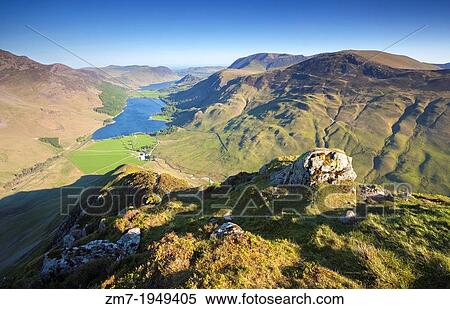 Lake Buttermere at Sunrise from the summit of Fleetwith Pike in the Lake District, England, UK. View Large Photo Image Stock Photography - Lake Buttermere at Sunrise from the summit of Fleetwith Pike in the Lake District, England, UK.. Fotosearch