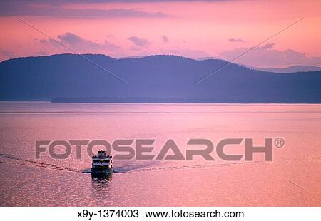 Lake Champlain, New England, USA Cruise boat called Ethan Allen looking west from Vermont shore at Burlington to New York State View Large Photo Image Stock Image - Lake Champlain, New England, USA Cruise boat called Ethan Allen looking west from Vermont shore at Burlington to New York State. Fotosearch