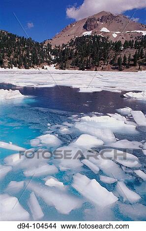 Lake Helen thawing in summer below Lassen Peak, Lassen Volcanic National Park. California, USA View Large Photo Image Picture - Lake Helen thawing in summer below Lassen Peak, Lassen Volcanic National Park. California, USA. Fotosearch