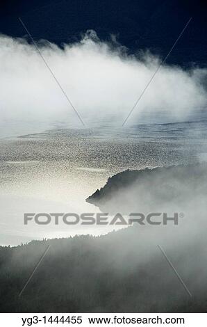 Lake mist at dawn in Nelson Lakes national park, New Zealand View Large Photo Image Stock Photography - Lake mist at dawn in Nelson Lakes national park, New Zealand. Fotosearch