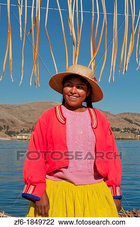Lake Titicaca Peru with local traditional woman of Uros Tribe history in colorful clothes near Puno View Large Photo Image Stock Image - Lake Titicaca Peru with local traditional woman of Uros Tribe history in colorful clothes near Puno. Fotosearch