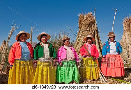 Lake Titicaca Peru with local traditional women of Uros Tribe history in colorful clothes near Puno View Large Photo Image Stock Image - Lake Titicaca Peru with local traditional women of Uros Tribe history in colorful clothes near Puno. Fotosearch