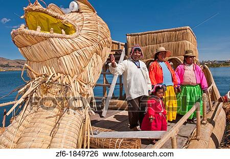 Lake Titicaca Peru with local traditional women on straw dragon boat of Uros Tribe history in colorful clothes near Puno View Large Photo Image Stock Photograph - Lake Titicaca Peru with local traditional women on straw dragon boat of Uros Tribe history in colorful clothes near Puno. Fotosearch