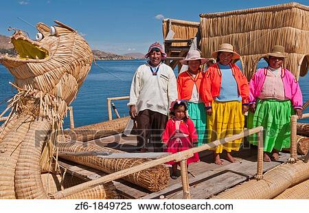 Lake Titicaca Peru with local traditional women on straw dragon boat of Uros Tribe history in colorful clothes near Puno View Large Photo Image Stock Photography - Lake Titicaca Peru with local traditional women on straw dragon boat of Uros Tribe history in colorful clothes near Puno. Fotosearch